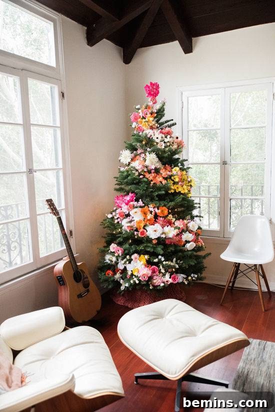 10 Visionary Christmas Tree Decorating Styles 3 Stunning floral Christmas tree decorated with a beautiful spiral of vibrant flowers