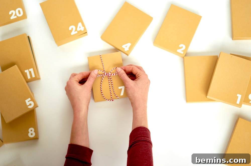 A person puts twine around a numbered piece of paper.