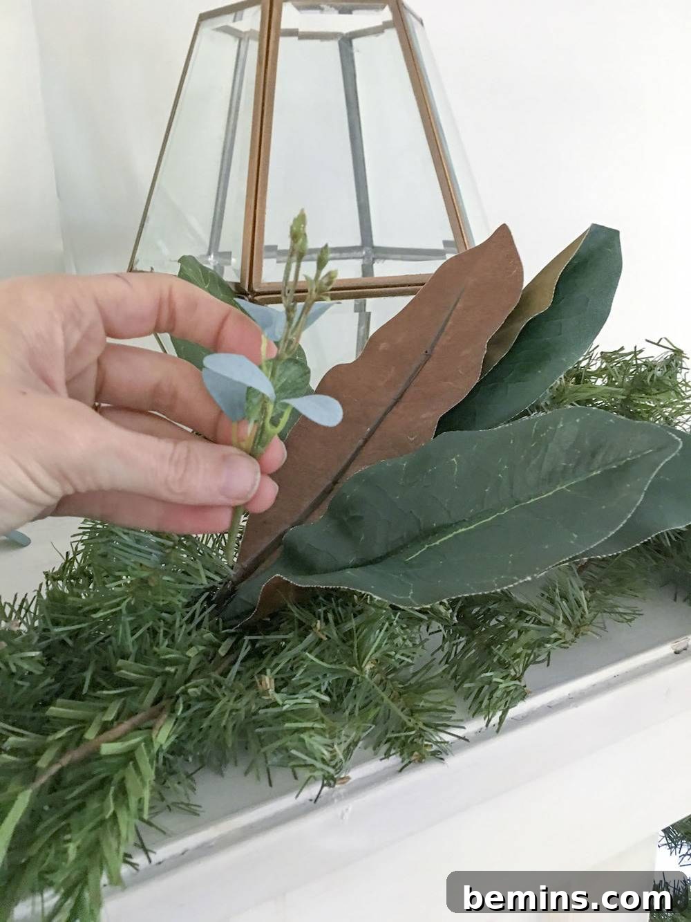 Adding eucalyptus sprigs