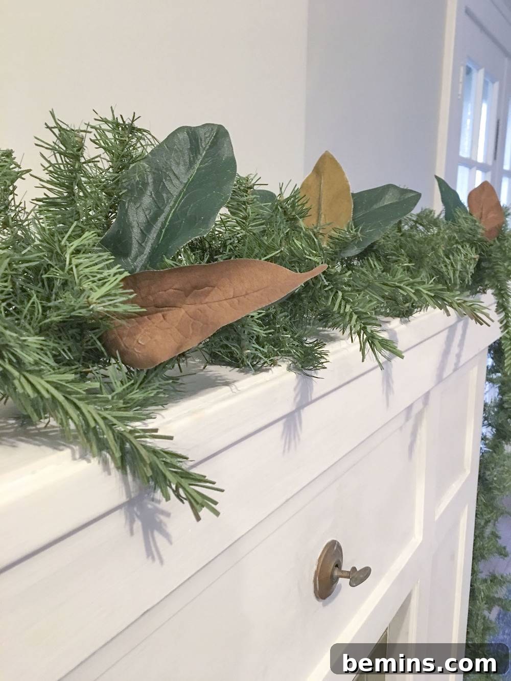 Adding glued leaves to garland