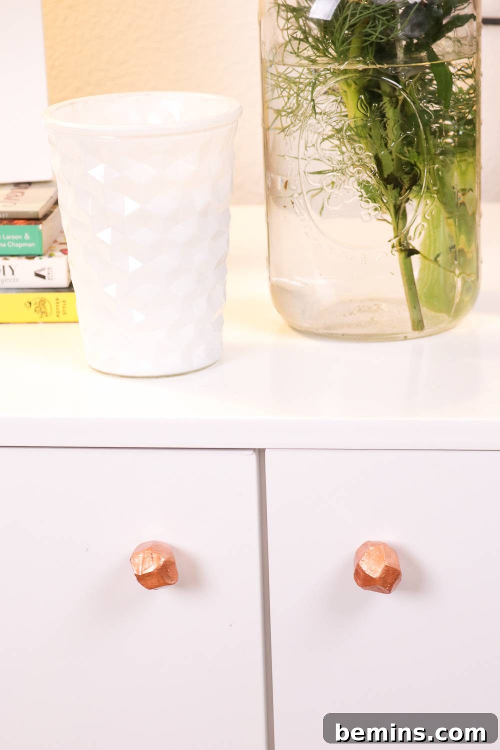 Finished DIY Clay Faceted Drawer Handles installed on a cabinet.