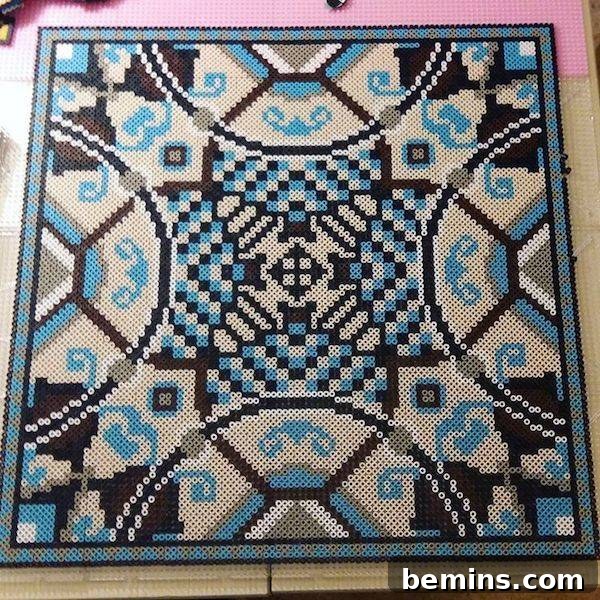 An intricate design that combines elements of a rug and a board game, all made from Perler beads.
