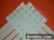 Paper Flips: DIY Footwear Fun 5 Initial weave of newspaper strips