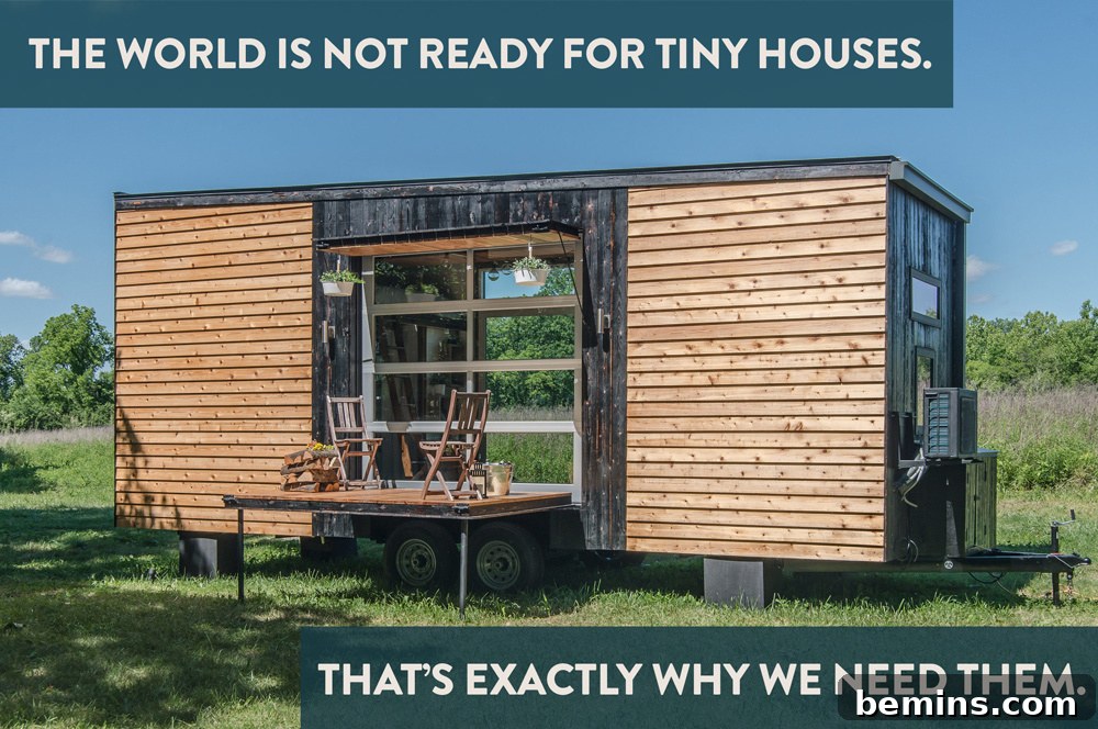 Tiny Houses: Sustainable Living for Everyone 2 A cozy tiny house with large windows and a table in front, showcasing the minimalist lifestyle.