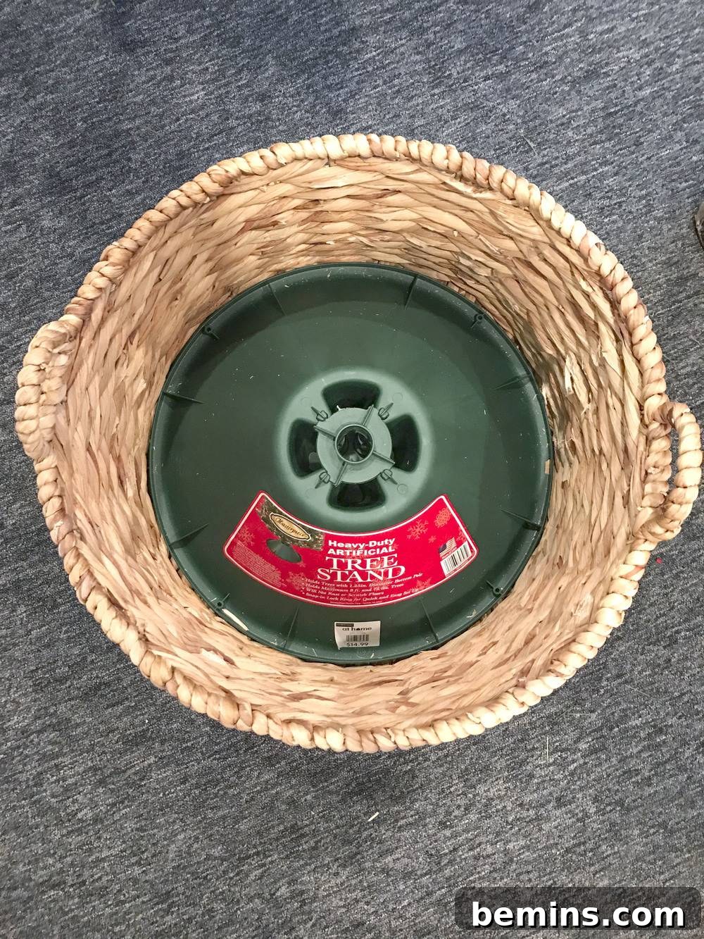Wicker basket with a tree base installed inside.