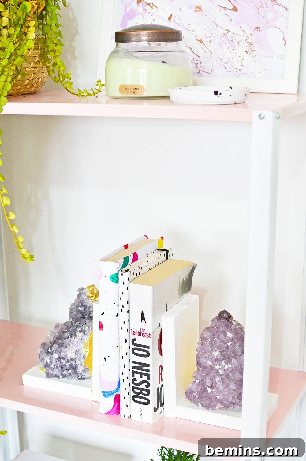 Finished DIY Amethyst Bookends holding books on a shelf
