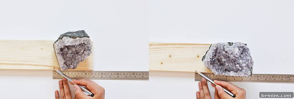 Measuring amethyst crystal against pine lumber