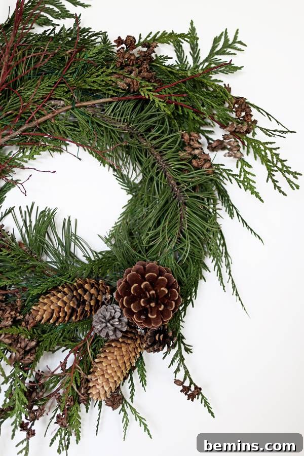 Adding Pinecones to the Wreath