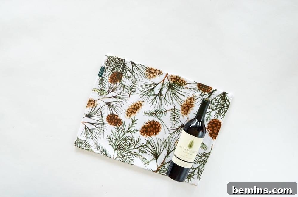 A Napkin with a Colorful Design that Shows Flowers and Wine, Used as Gift Wrap