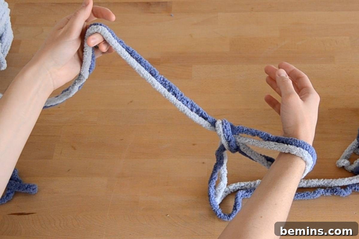 Feed your right arm through the slip knot