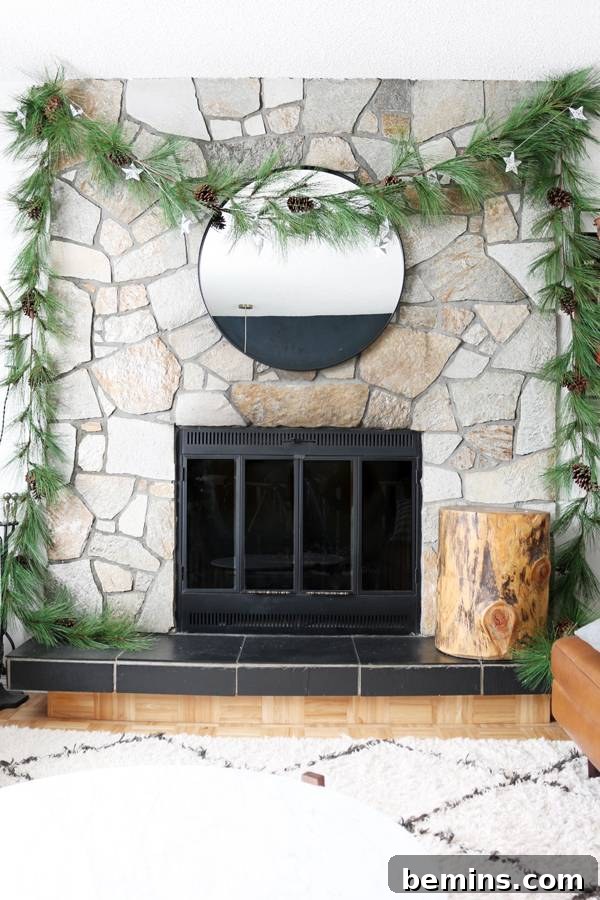 Hanging a fireplace garland to create a focal point on a fireplace without a mantel.