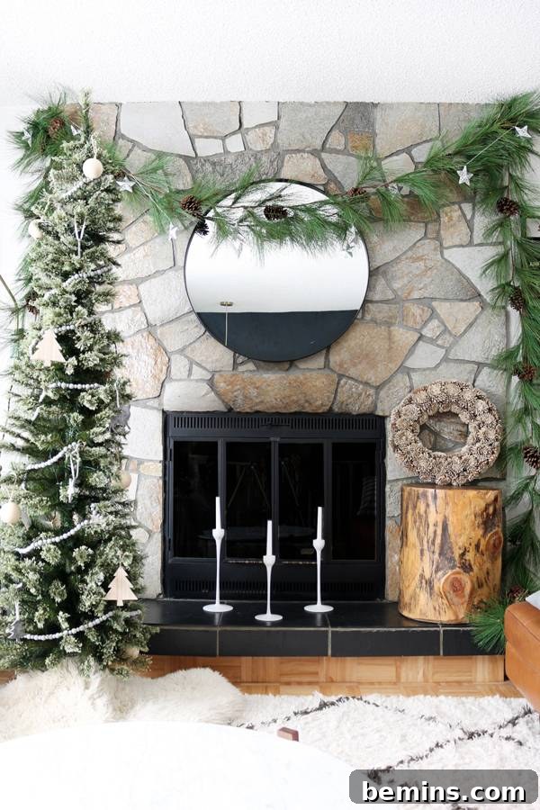 Balancing the design by adding a wood stump side table with a wreath on top.