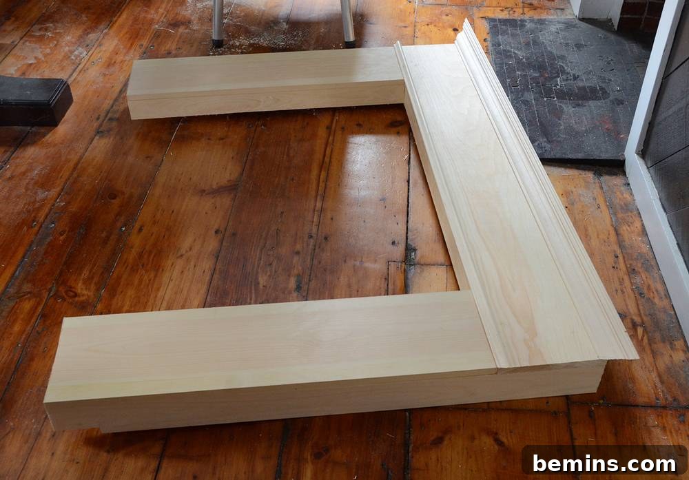 Crafting Your Own Fireplace Mantel 10 Gluing the large crown molding onto the DIY wooden mantel
