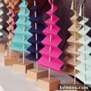 Making Your Home Irresistibly Festive This Christmas 7 Easy Mantel Idea: Colorful Paper Tree Forest, a whimsical and affordable way to decorate your mantel.