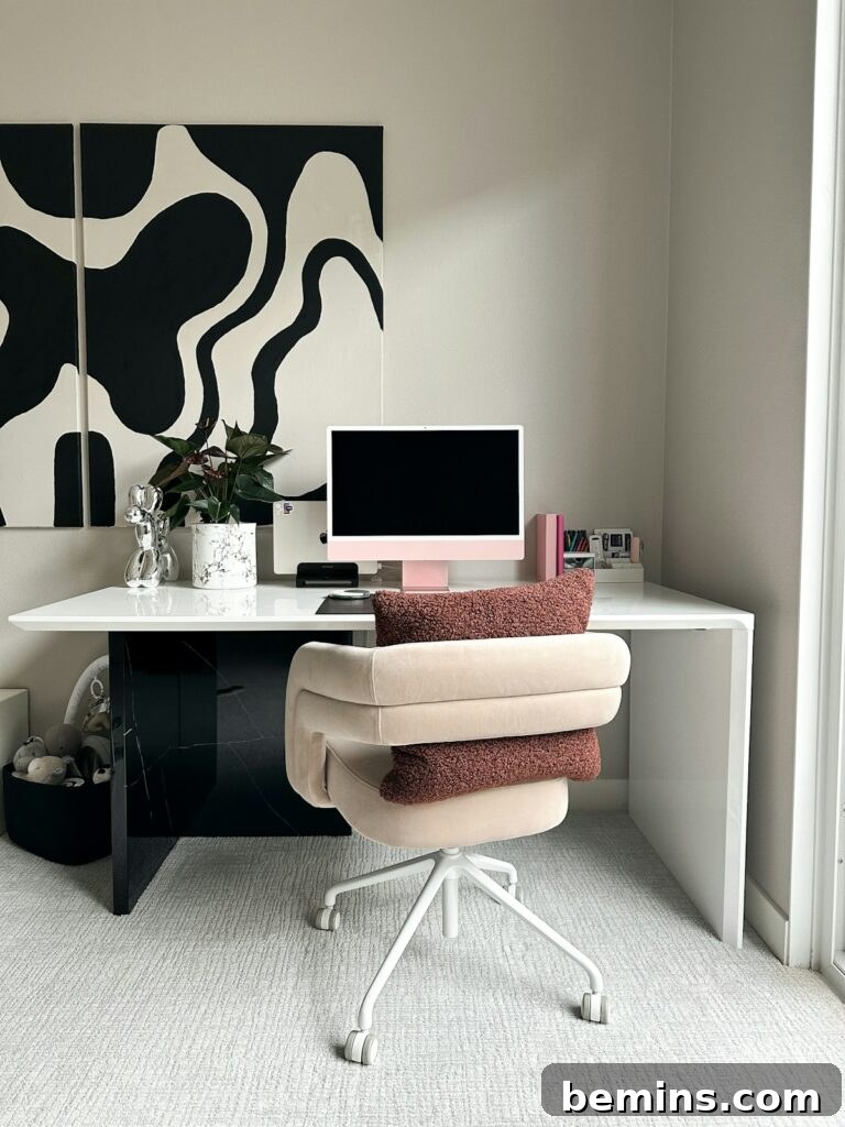 Workspace Bliss: Desk Organization Secrets 4 A modern desk setup with a computer, a monitor, and a few carefully chosen accessories, showcasing a balance between functionality and aesthetics.