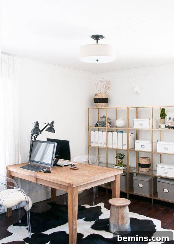 30 Impeccably Organized Studios for Creative Genius 22 Elegant home office with gray and white storage boxes.