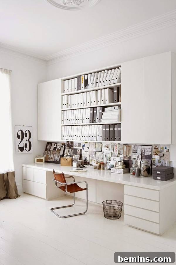 30 Impeccably Organized Studios for Creative Genius 27 Organized workspace with closed storage and numerous white magazine files.