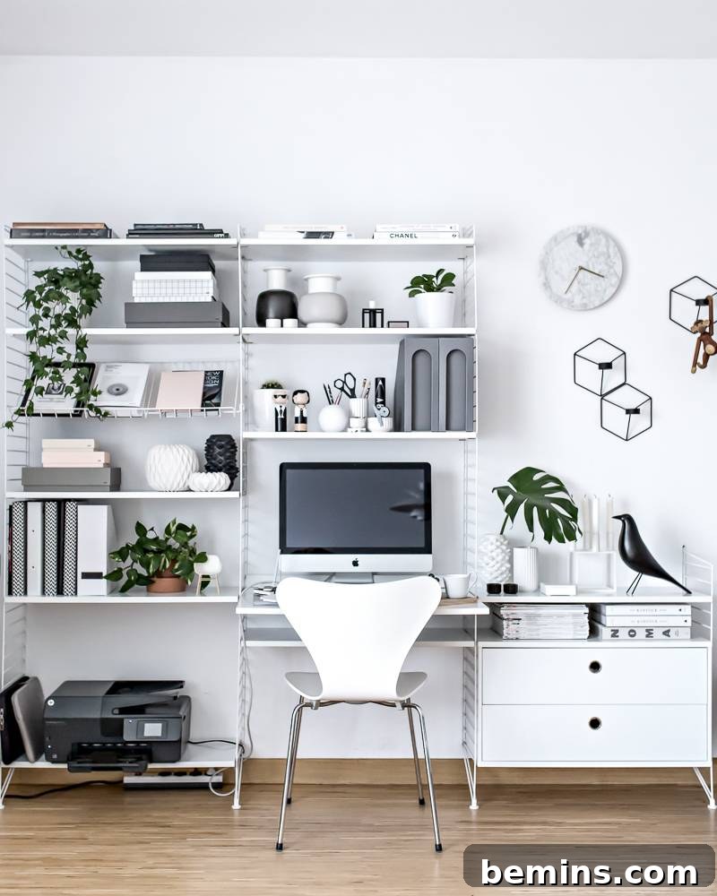30 Impeccably Organized Studios for Creative Genius 4 Home office with extensive wire shelving for storage boxes.