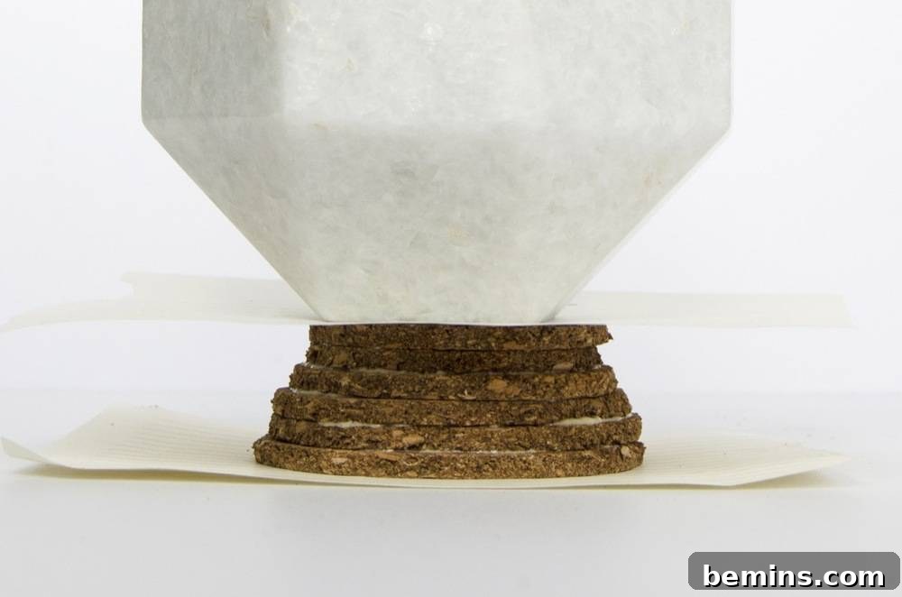 Vase to Vault: The Thrifty Home Decor Upgrade 10 Apply weight while glue dries.