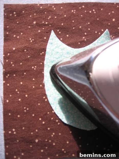 Iron the applique onto the coaster fabric.