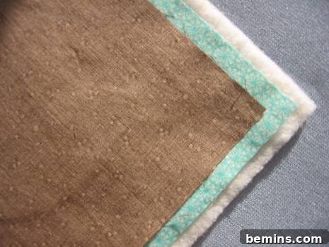 Stack the fabric and batting layers for sewing.
