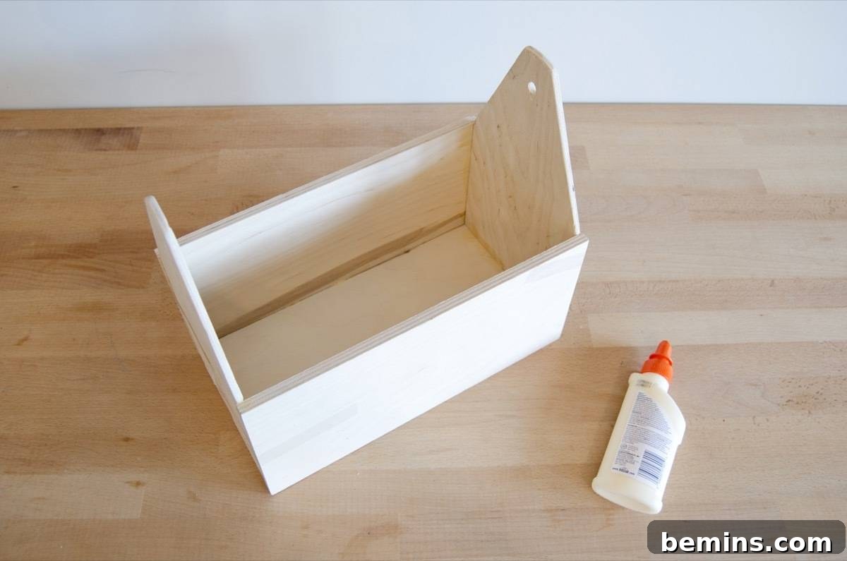 DIY Cleaning Caddy to Conquer Household Chores 7 DIY Wood Tote: How to make a wooden carrier for your household cleaning supplies