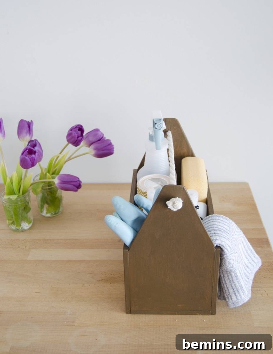 DIY Cleaning Caddy to Conquer Household Chores 10 Learn how to make a handmade cleaning caddy with a few wood boards and rope.