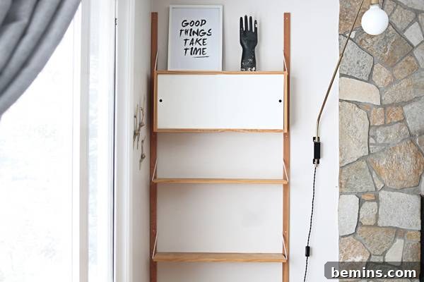 A sculptural piece adds a touch of whimsy to the shelf.