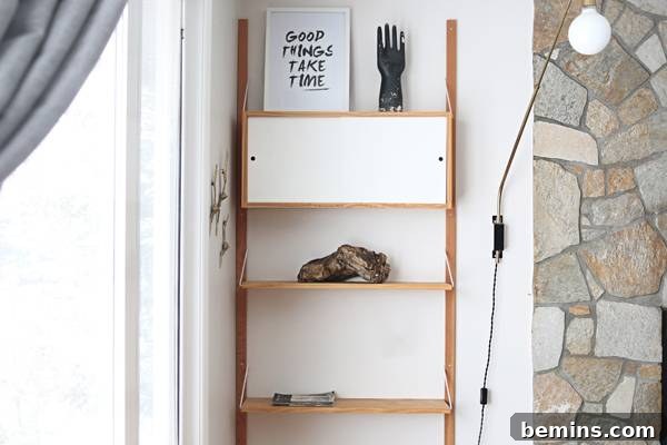 A stack of vintage books adds texture and color to the shelf.