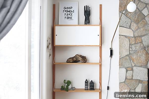 Decorative candles add warmth and ambiance to the shelf.