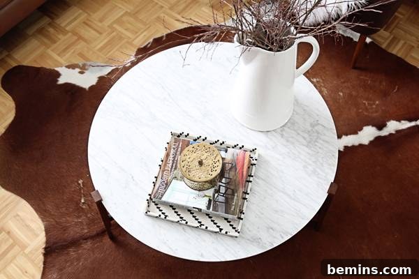 A sculptural element adds visual interest to the coffee table arrangement.