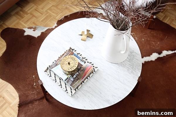 A vase with branches adds a natural and neutral touch to the coffee table.