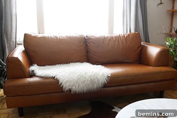 A clean, empty sofa ready for styling with Scandinavian elements.