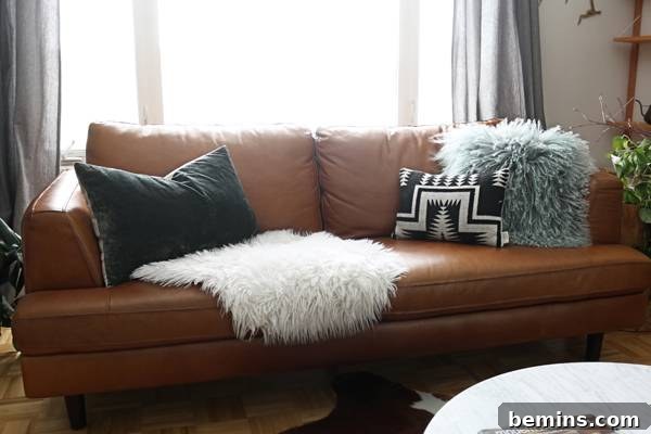 A sheepskin rug draped over the sofa adds warmth and texture.