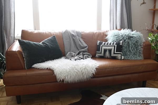 Pillows in complementary colors and textures enhance the sofa's aesthetic.
