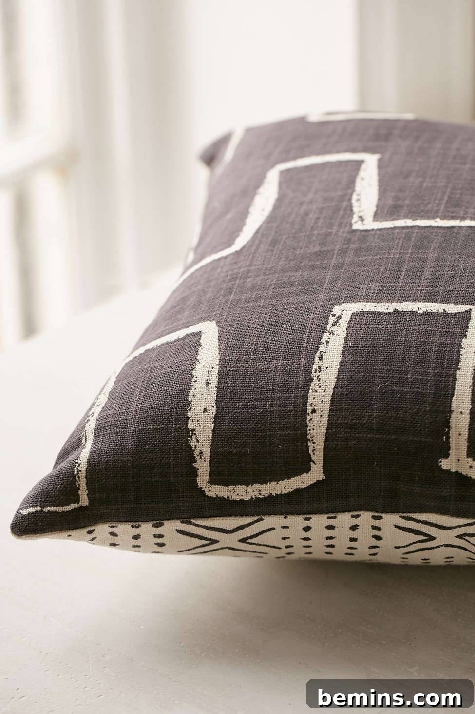 Irresistibly Cozy: 20 Scandinavian Pillows and Throws to Transform Your Home 16 Locust Malki Pillow with Black and White Design
