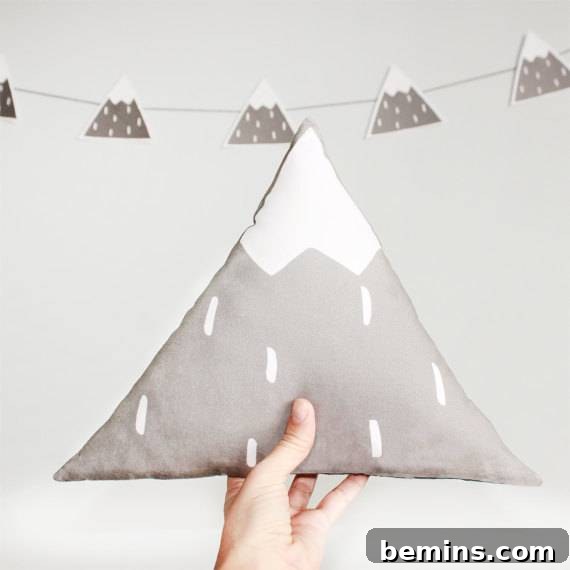 Irresistibly Cozy: 20 Scandinavian Pillows and Throws to Transform Your Home 17 Mountain Pillow - A Triangular Pillow