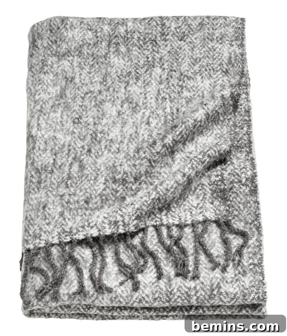 Irresistibly Cozy: 20 Scandinavian Pillows and Throws to Transform Your Home 18 Herringbone Throw Blanket