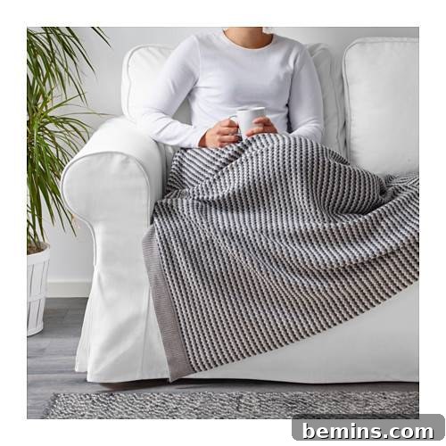 Irresistibly Cozy: 20 Scandinavian Pillows and Throws to Transform Your Home 7 Gray Throw Blanket from IKEA