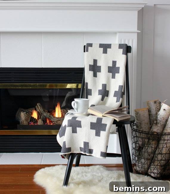Irresistibly Cozy: 20 Scandinavian Pillows and Throws to Transform Your Home 9 Cross Throw Blanket in Black and White