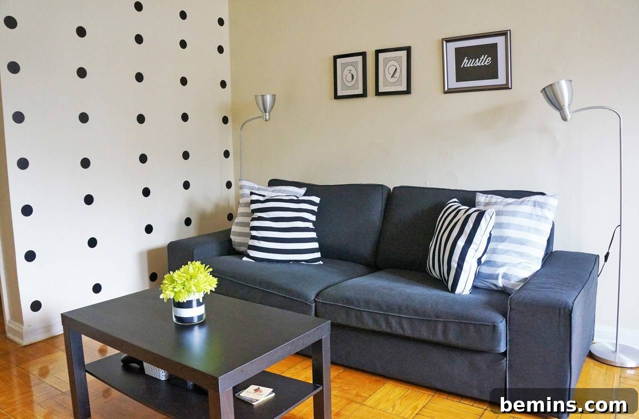 Rental living room with wall decals creating a unique accent