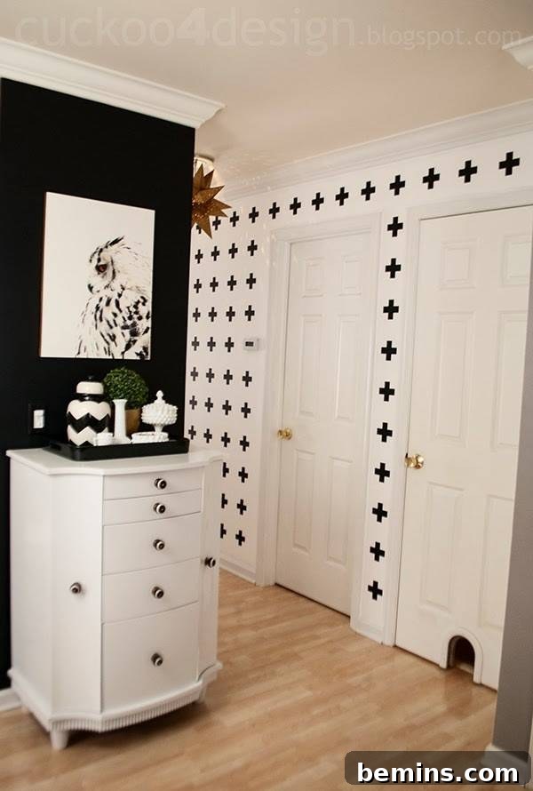 Vinyl wallpaper offers a bold and geometric accent wall solution.