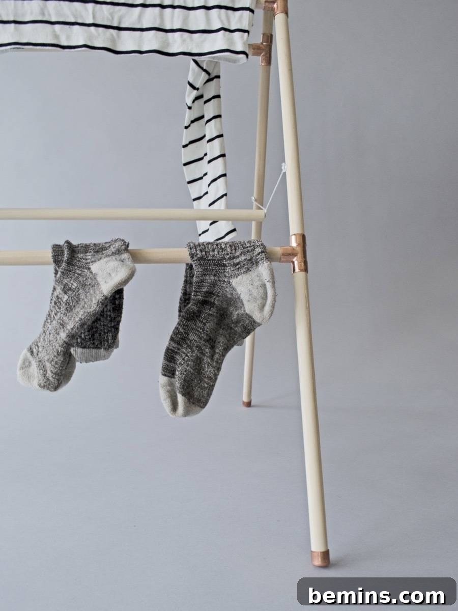 Save $ by air-drying your laundry. Make your own clothes drying rack out of wood and copper.