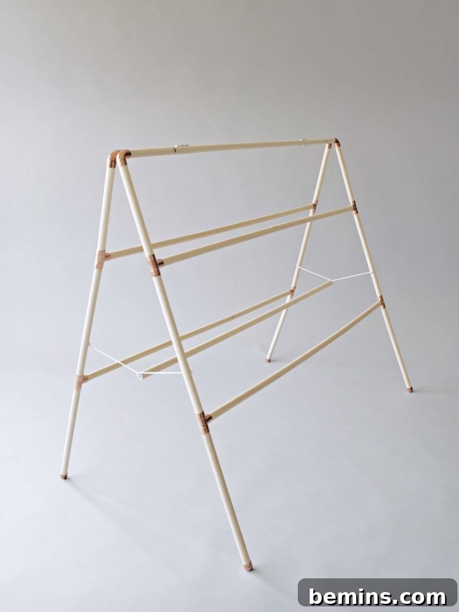 You don't have to be a master craftsman to make a clothes drying rack. All you need are some wooden dowels, copper pipe fittings, and glue!