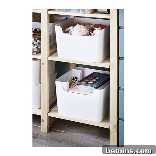 Easy-to-access bins organizing snacks in a kitchen cabinet