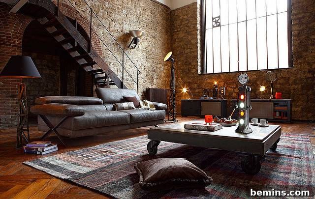 Sunlit industrial-chic loft featuring iron stairs and weighty materials.