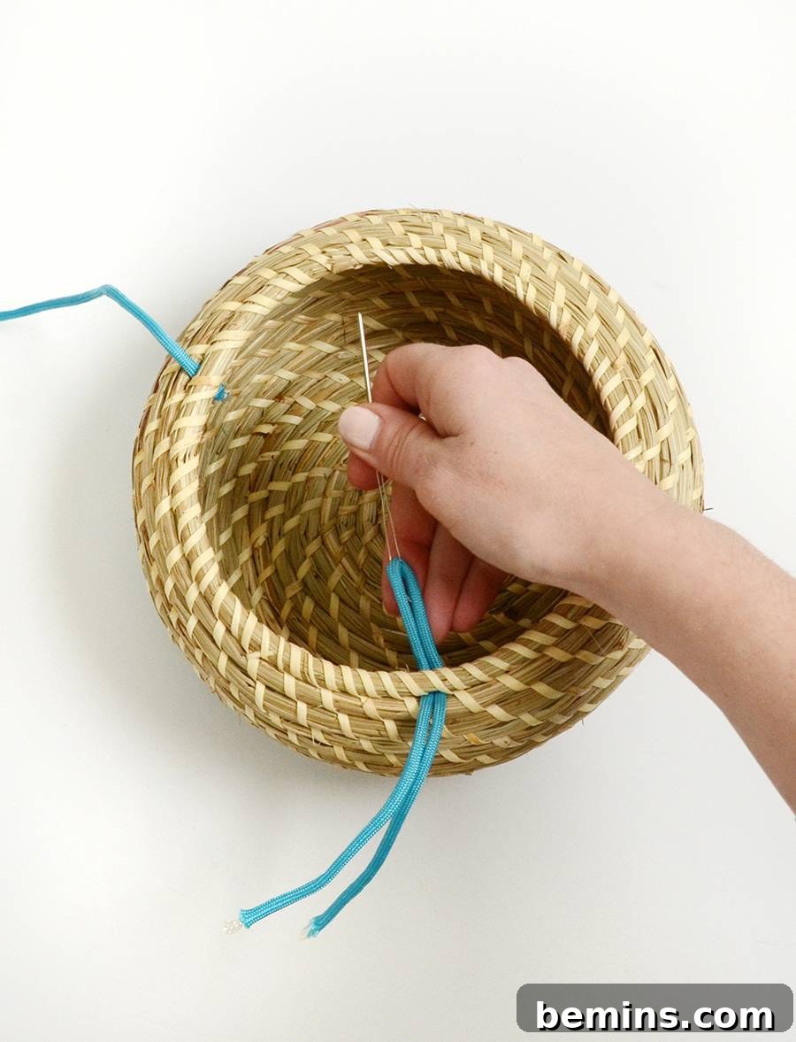 Threading the cord through the largest basket