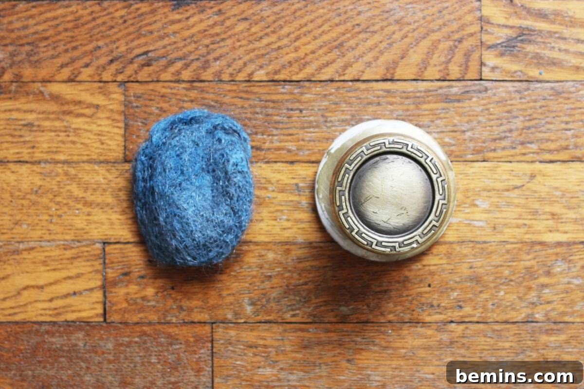 Use steel wool to remove paint from door knobs
