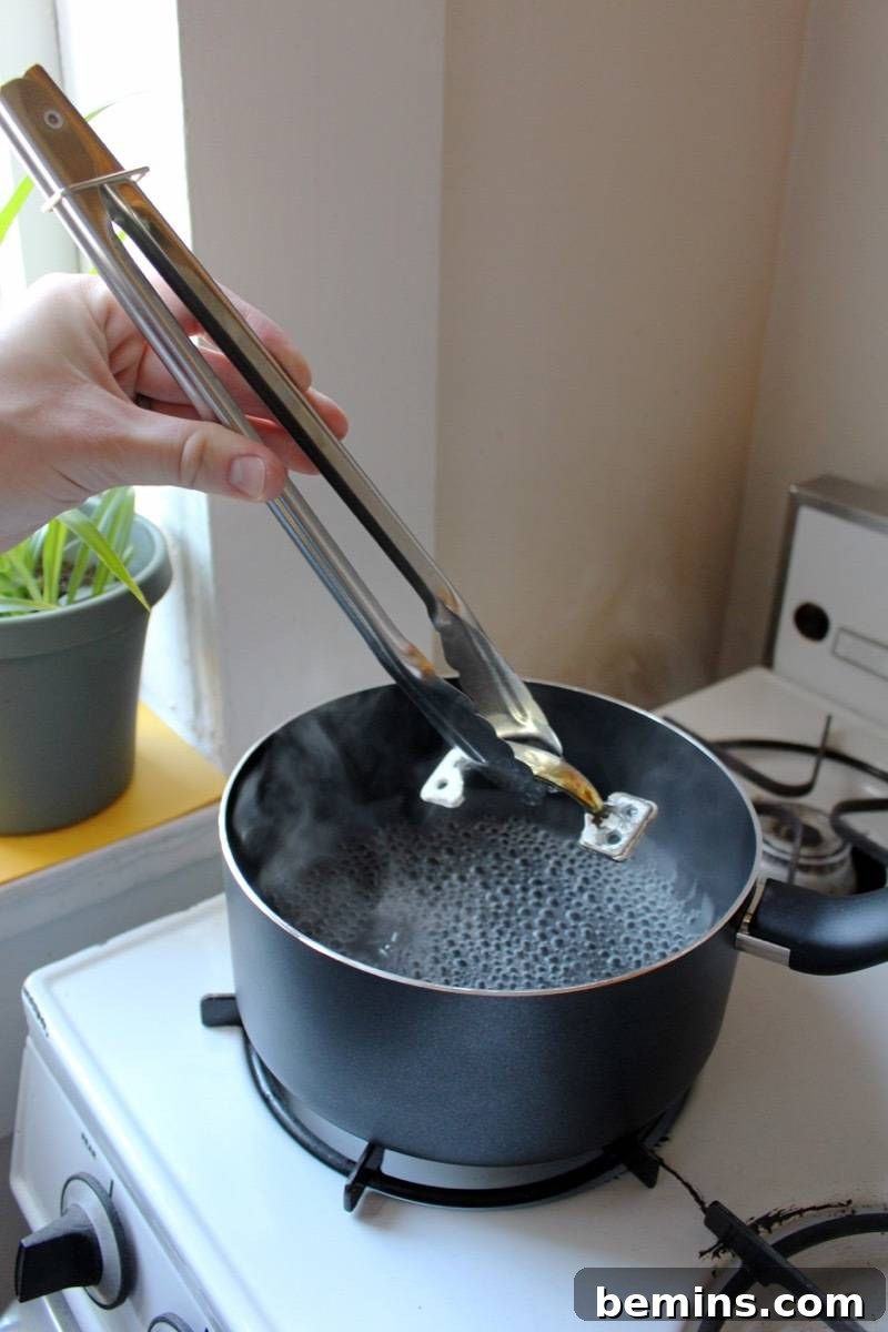 How to remove paint from hardware: Heat in water to loosen paint