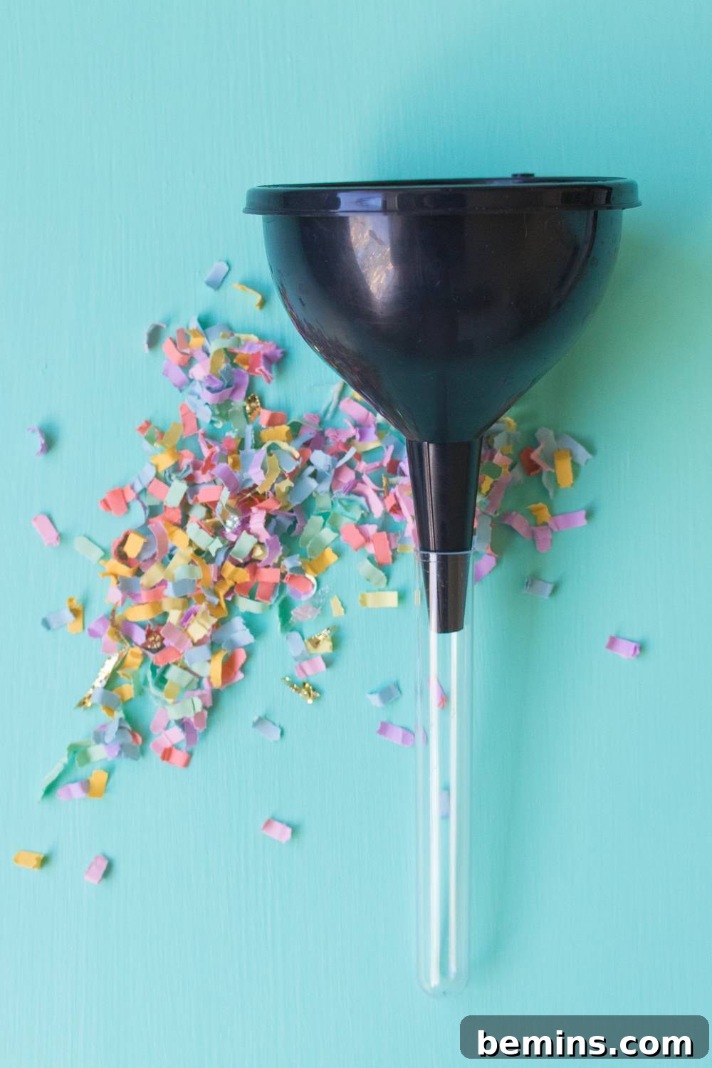 Filling the test tubes with confetti.